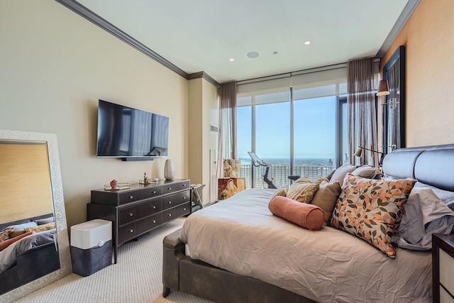 bedroom featuring carpet floors, ornamental molding, and floor to ceiling windows