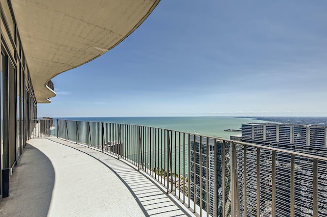 balcony featuring a water view