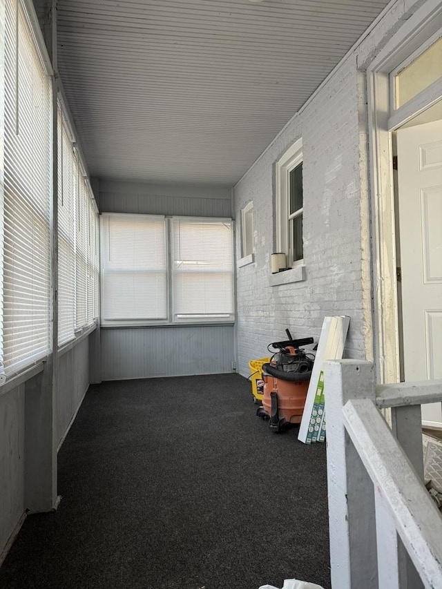 unfurnished sunroom featuring a healthy amount of sunlight