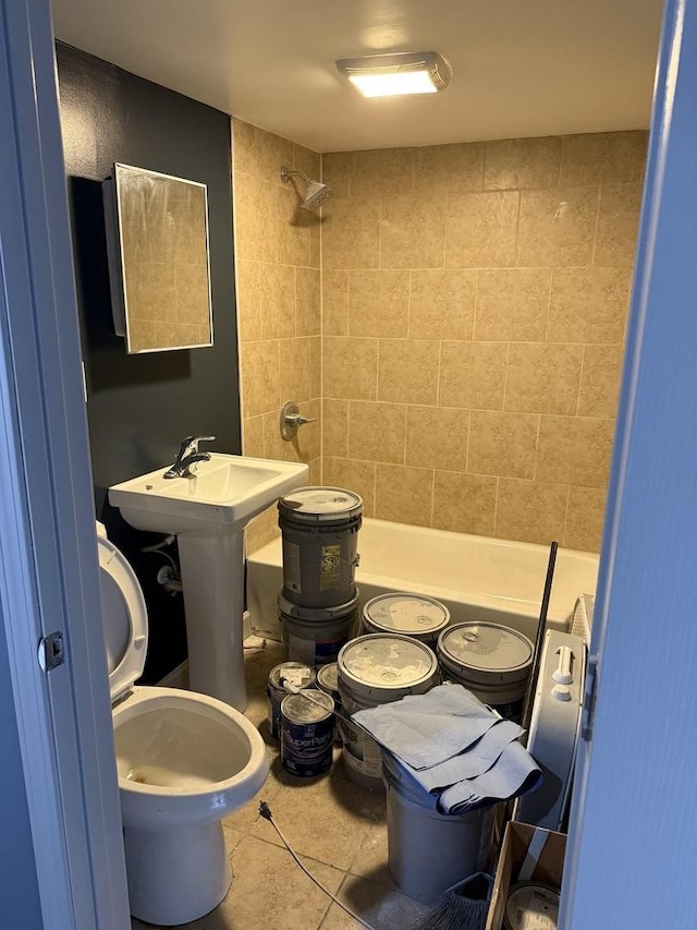 bathroom featuring tile patterned floors and toilet