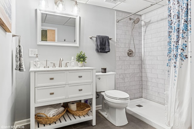 bathroom featuring tile patterned flooring, vanity, toilet, and a shower with curtain