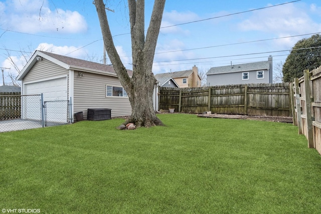 view of yard featuring an outbuilding and a garage