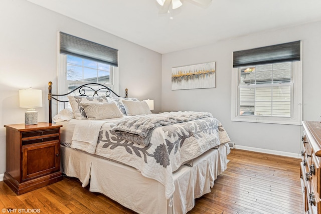 bedroom with hardwood / wood-style flooring and ceiling fan