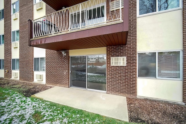 entrance to property featuring a patio area