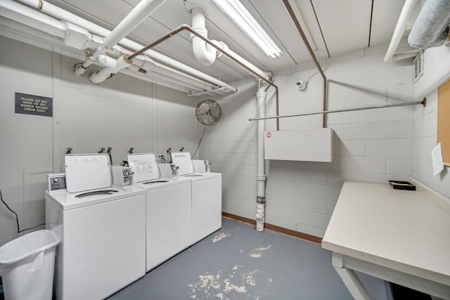 clothes washing area featuring washer and dryer