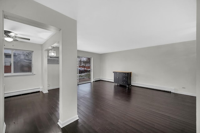 unfurnished living room with dark hardwood / wood-style flooring, ceiling fan, and baseboard heating