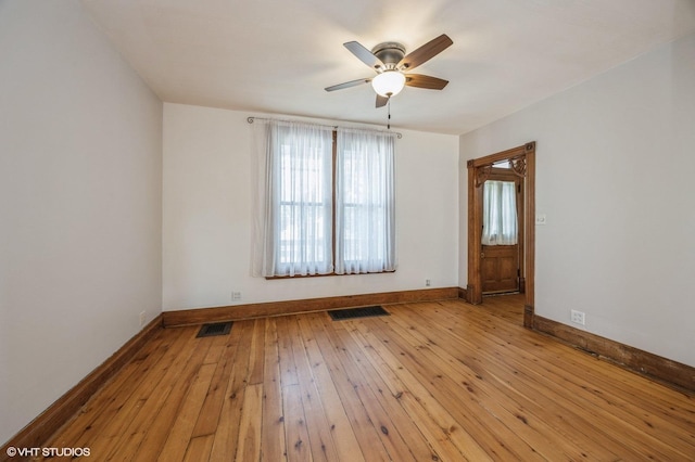 unfurnished room featuring ceiling fan and light wood-type flooring