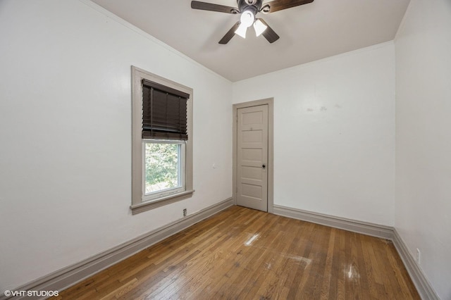 empty room featuring hardwood / wood-style floors and ceiling fan