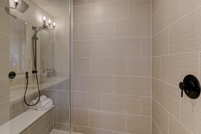 bathroom with a tile shower