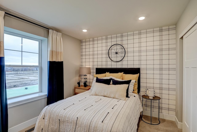 bedroom with light colored carpet