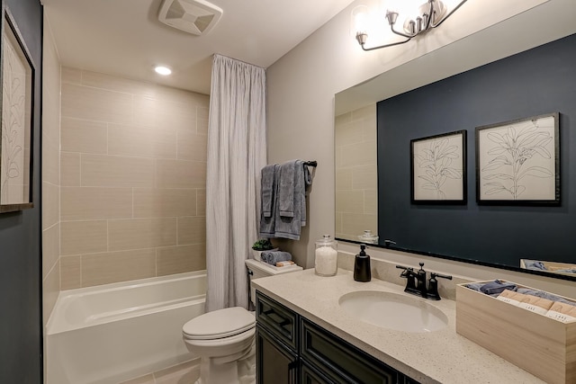 full bathroom featuring shower / tub combo with curtain, vanity, toilet, and tile patterned flooring