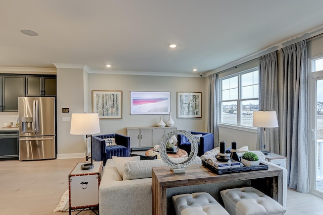 living room with light hardwood / wood-style flooring and ornamental molding