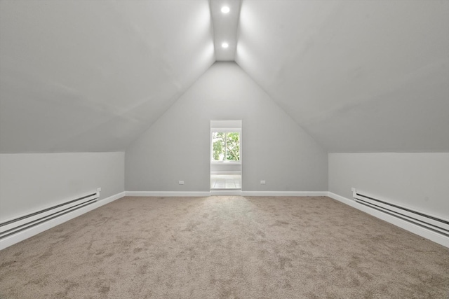 bonus room featuring baseboard heating, lofted ceiling, and carpet floors