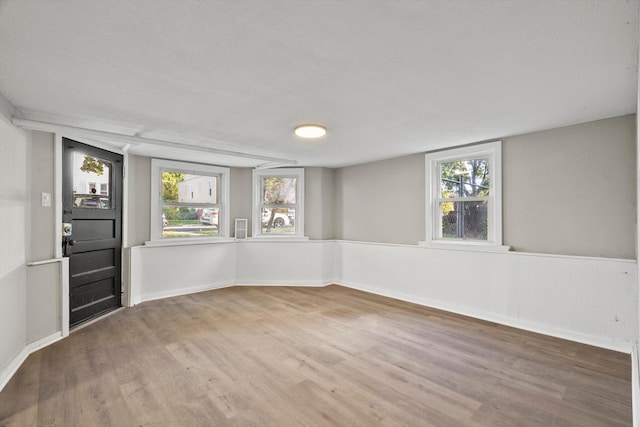 empty room with wood-type flooring