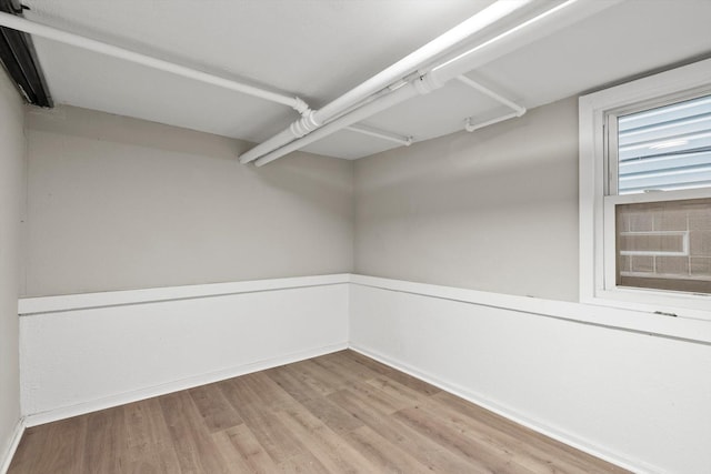 spacious closet with light hardwood / wood-style floors