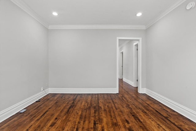 empty room with crown molding and dark wood-type flooring