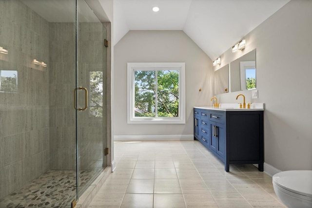 bathroom with vanity, lofted ceiling, tile patterned floors, and a shower with shower door