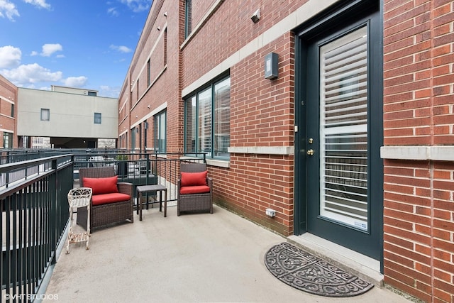 view of patio featuring a balcony