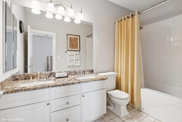 bathroom featuring shower / tub combo with curtain, a sink, toilet, and tile patterned floors