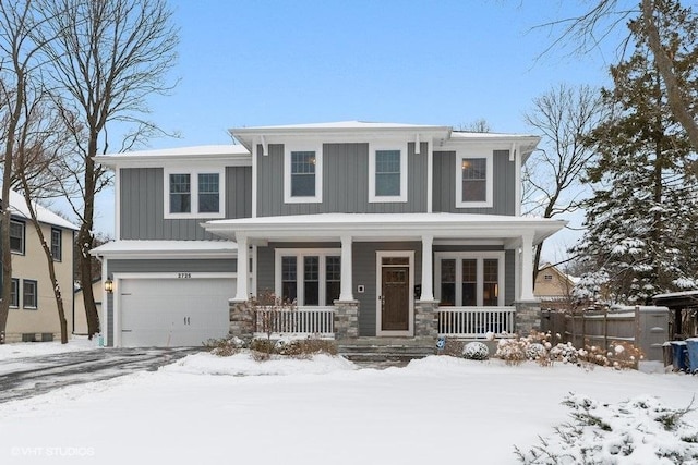 view of front of home with a garage and covered porch