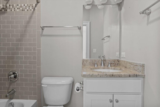 full bathroom featuring vanity, toilet, and tiled shower / bath