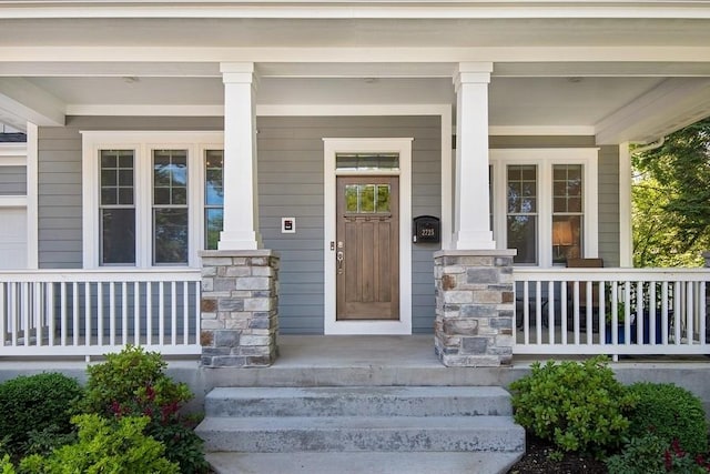 doorway to property with a porch