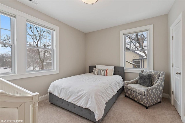 bedroom with light carpet