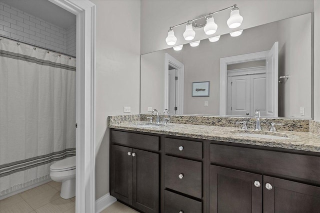 bathroom featuring tile patterned flooring, vanity, a shower with shower curtain, and toilet