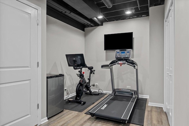 exercise area featuring wood-type flooring