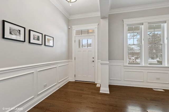 entryway featuring dark hardwood / wood-style flooring and crown molding