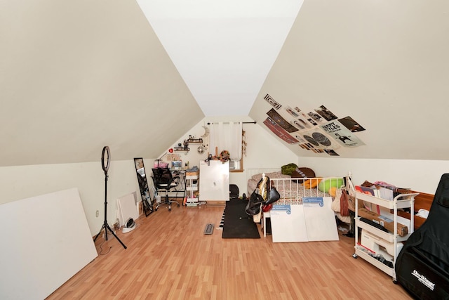 bonus room featuring lofted ceiling and light hardwood / wood-style floors