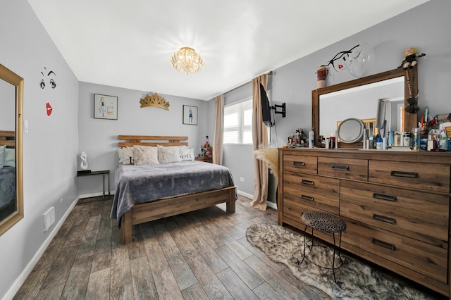 bedroom with dark hardwood / wood-style flooring