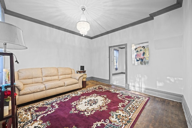 living room featuring an inviting chandelier, wood-type flooring, and ornamental molding