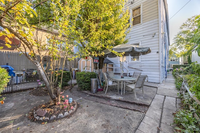 view of patio / terrace featuring a shed