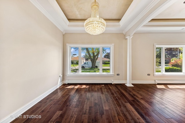 interior space with ornate columns, a raised ceiling, a baseboard heating unit, and dark wood-type flooring