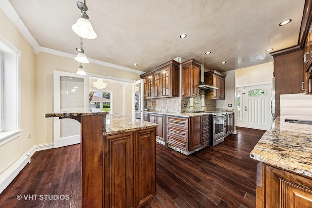 kitchen featuring pendant lighting, stainless steel stove, a baseboard heating unit, plenty of natural light, and a kitchen island