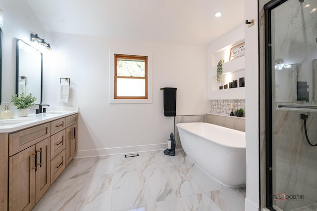 bathroom featuring vanity and independent shower and bath