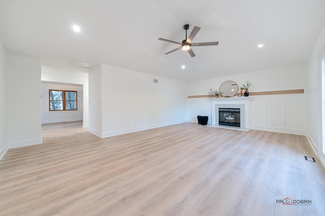 unfurnished living room with ceiling fan and light hardwood / wood-style flooring