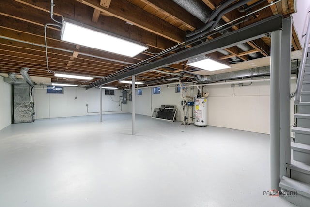 basement with gas water heater and electric panel