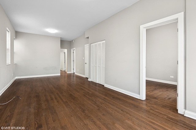 empty room featuring dark wood-type flooring