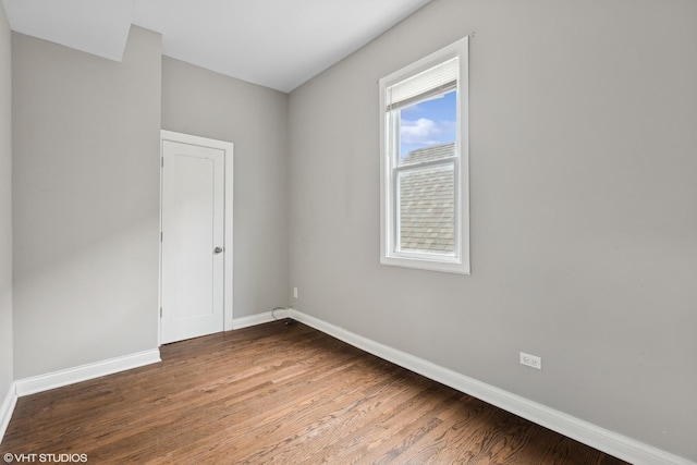 unfurnished room with hardwood / wood-style floors