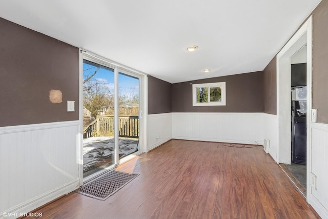 empty room with dark hardwood / wood-style floors