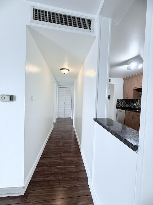 hallway featuring dark hardwood / wood-style flooring