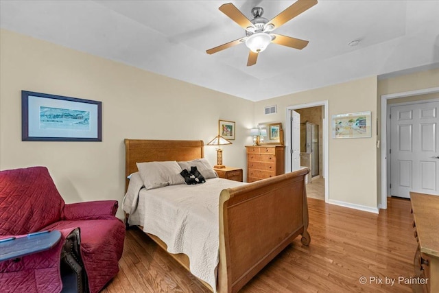 bedroom featuring hardwood / wood-style floors and ceiling fan