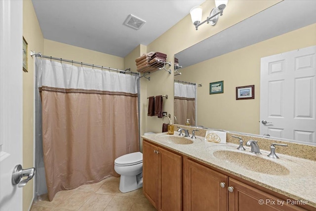 bathroom with vanity, a shower with shower curtain, tile patterned floors, and toilet