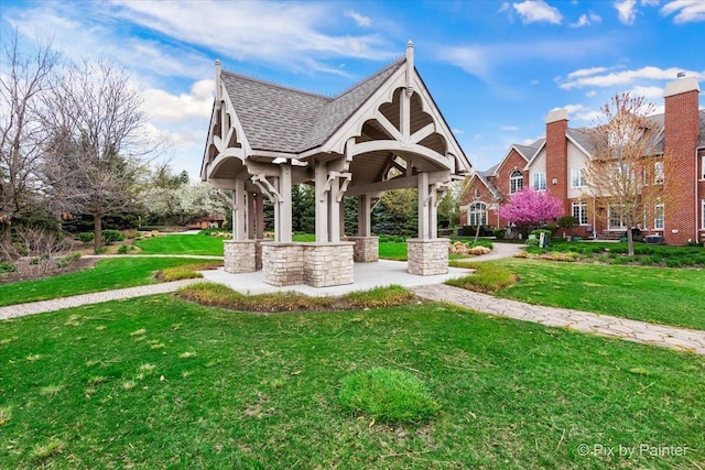 view of property's community with a lawn