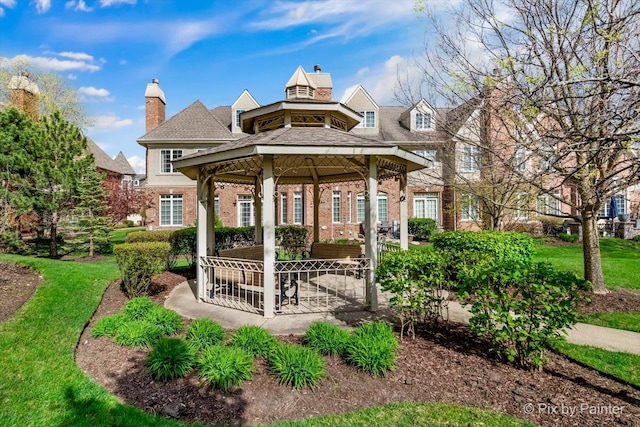 view of community featuring a gazebo and a lawn