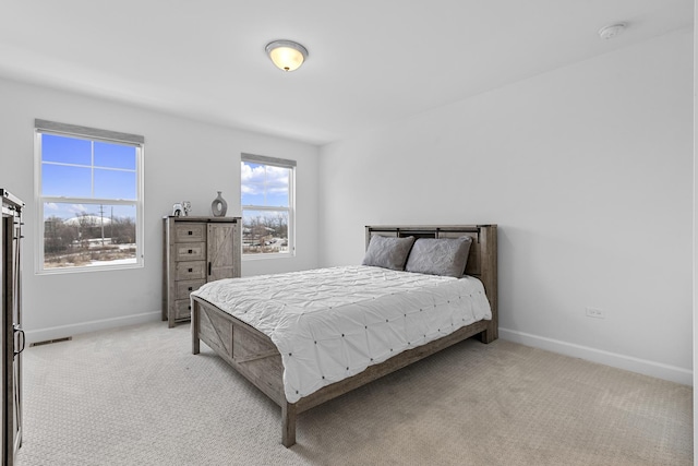 carpeted bedroom featuring a barn door