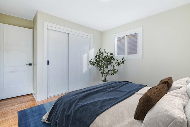 bedroom featuring hardwood / wood-style flooring and a closet