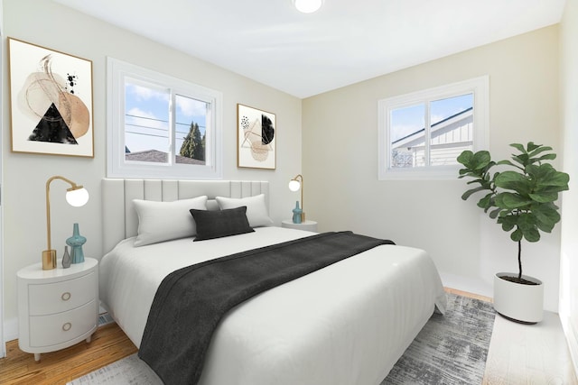 bedroom with hardwood / wood-style flooring